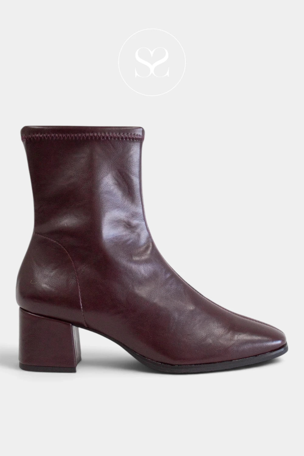 A miss elastic dark burgundy leather look ankle boot with a low block heel and square toe, shown in profile against a light gray background.