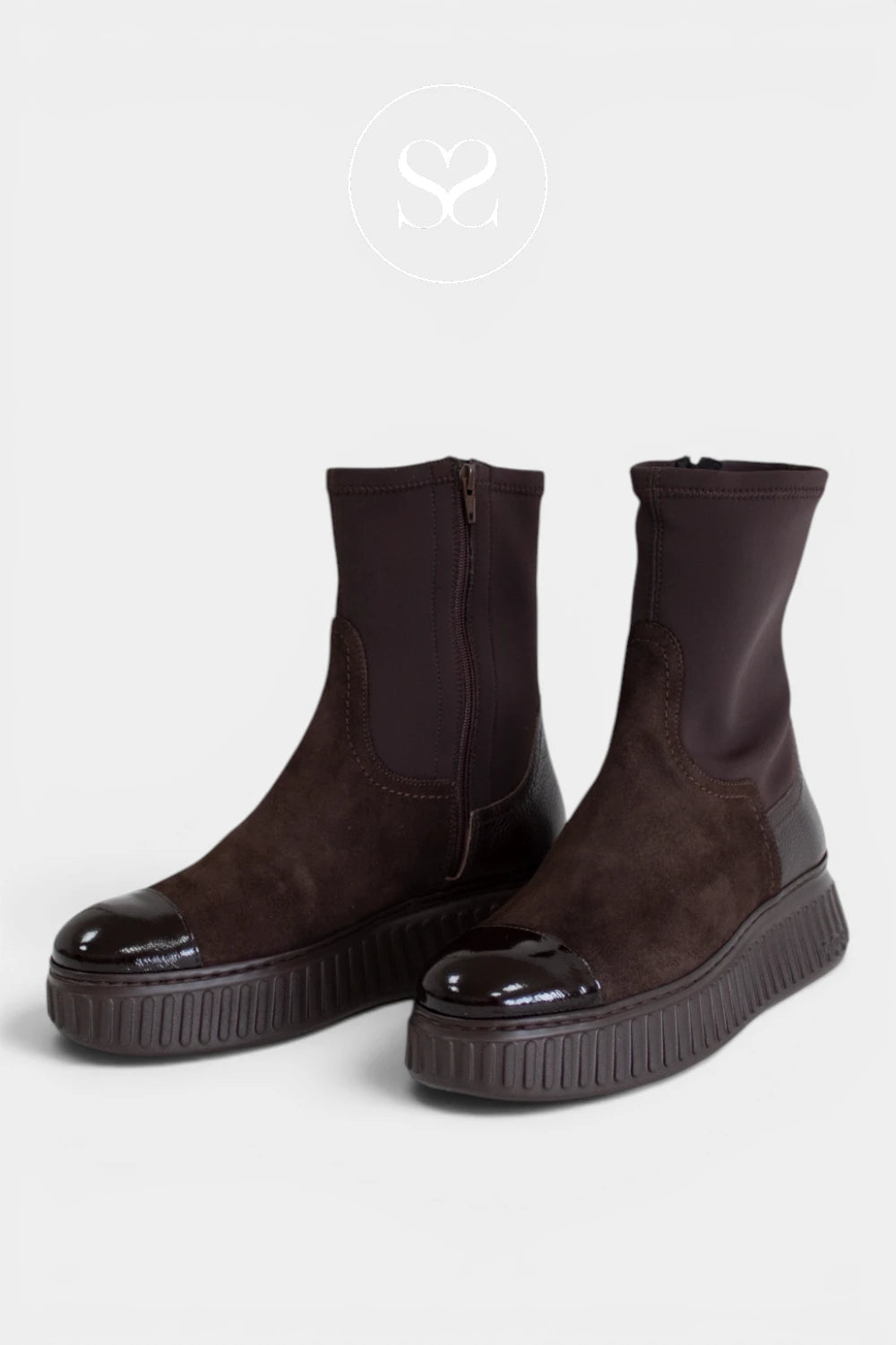 Brown sock boots with a patent toe cap, adding a polished contrast to the tonal monochrome design - Ireland