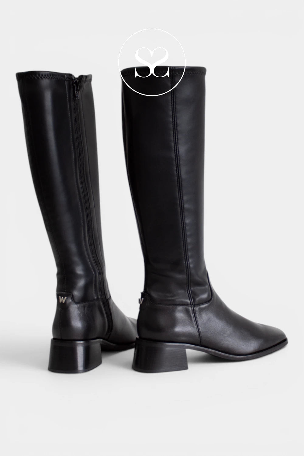 Women’s black long boots with a square toe, perfect for wearing with dresses, skirts or tucked-in jeans.