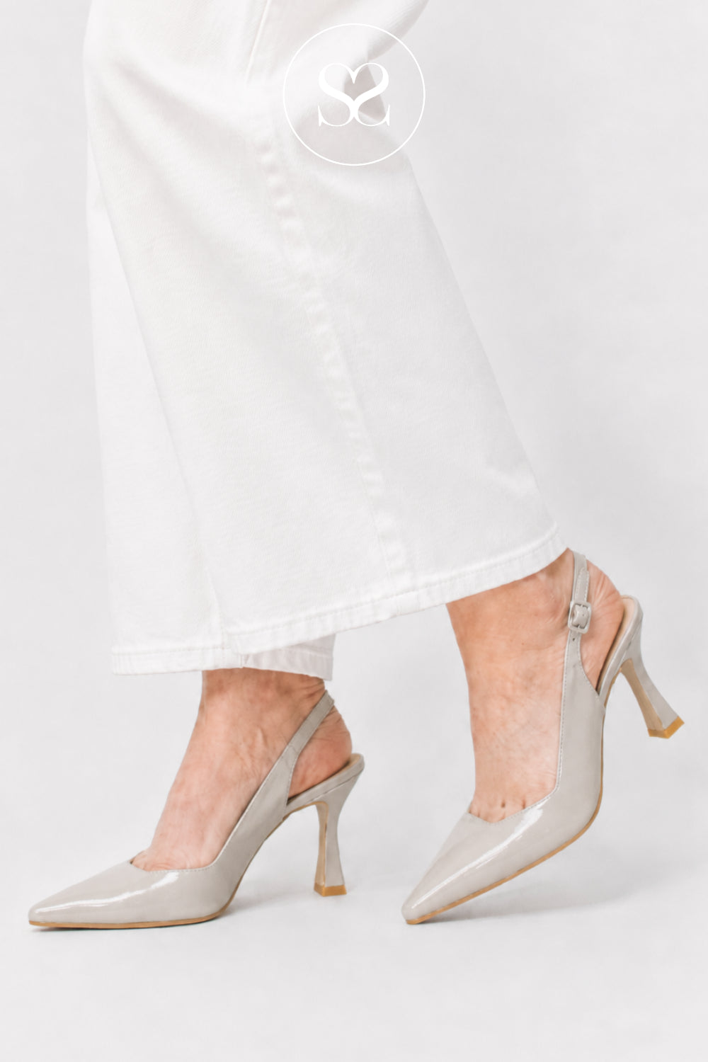 woman wearing beigh high heel slingbacks with white jeans - lodi shoes Ireland
