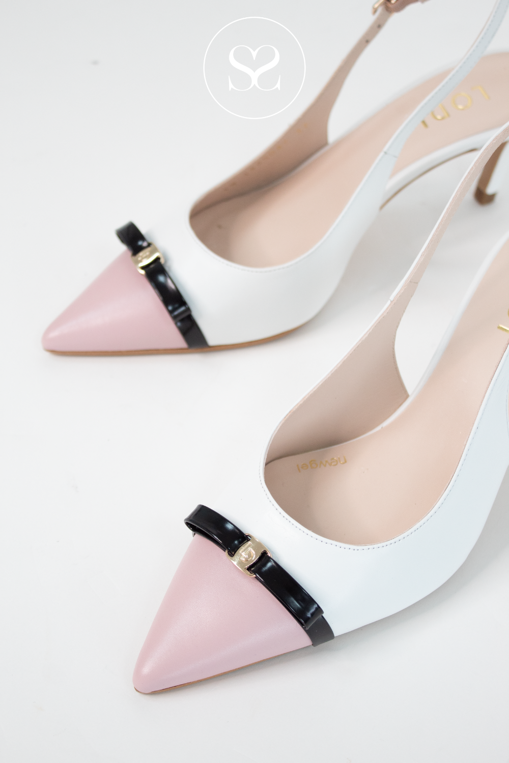 Lodi Nureia pointed toe heels with white and pink leather. Small black bow detail