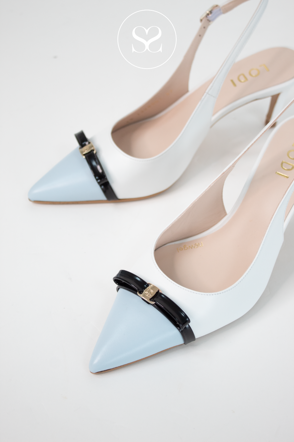 Lodi blue and white pointed toe mid heel slingback shoes