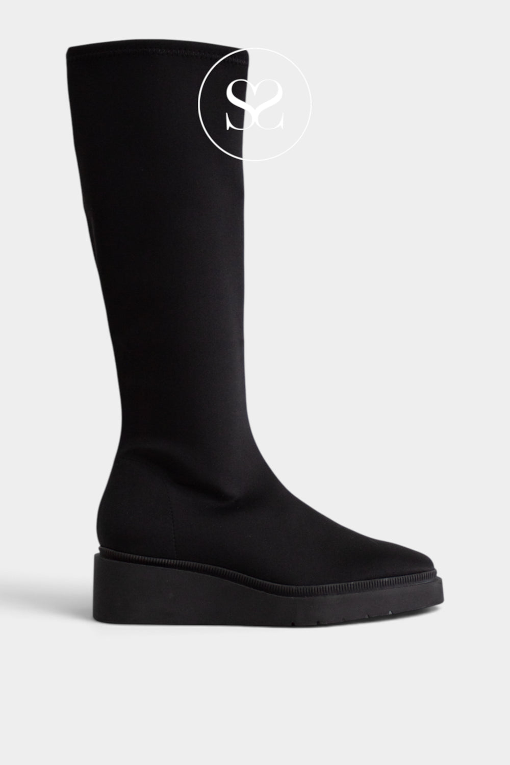 A single Miss Elastic black knee-high sock boot with a chunky platform sole, shown from a side profile on a light grey background.