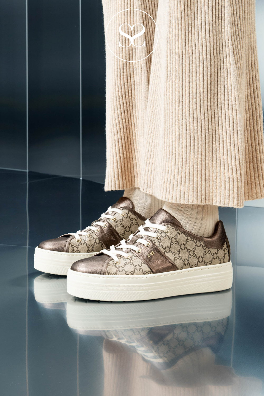 WOMAN WEARING NERO GIARDINI TRAINERS IRELAND
