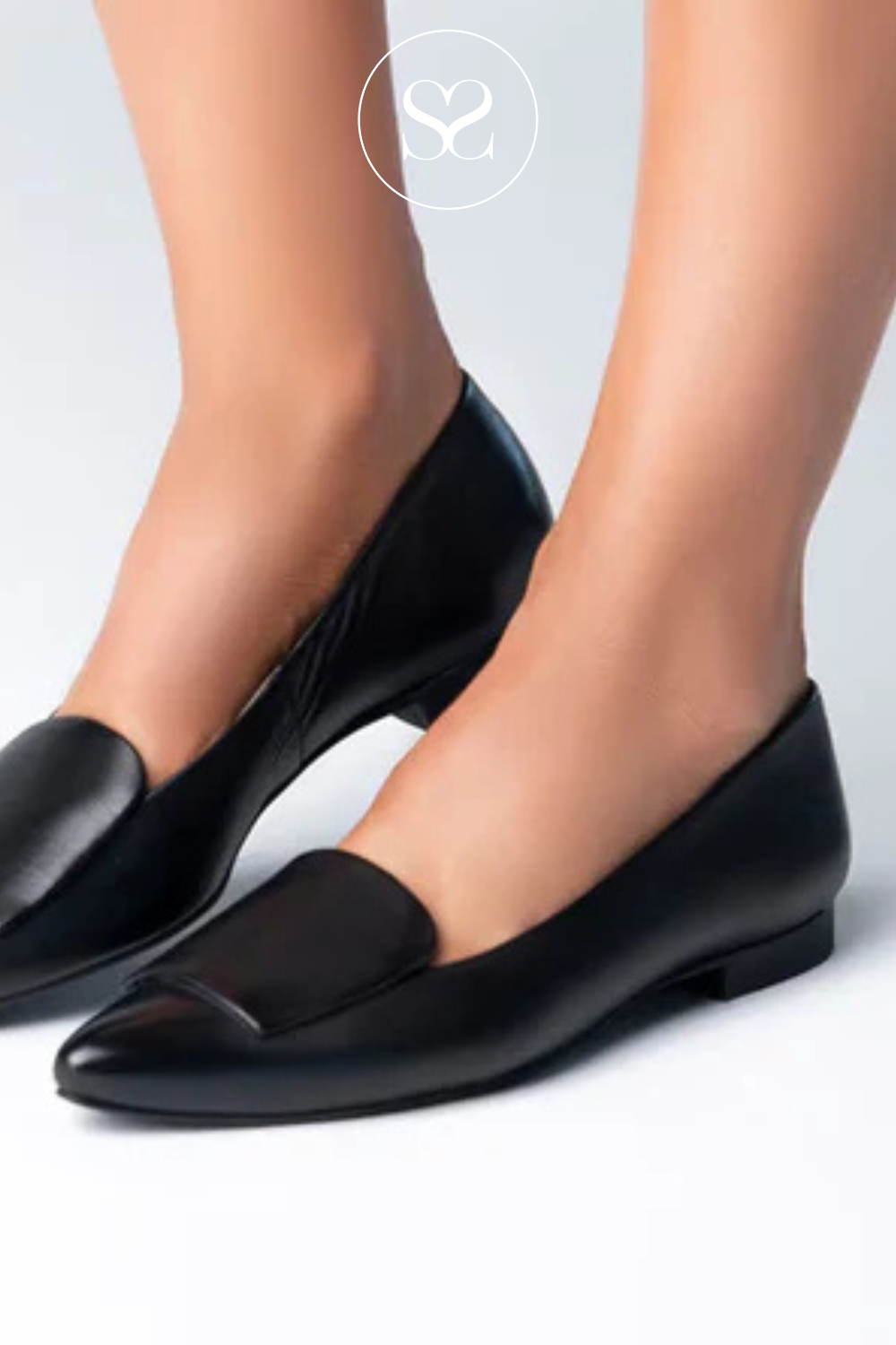 Woman wearing black pointed toe flats from Paul Green in Ireland