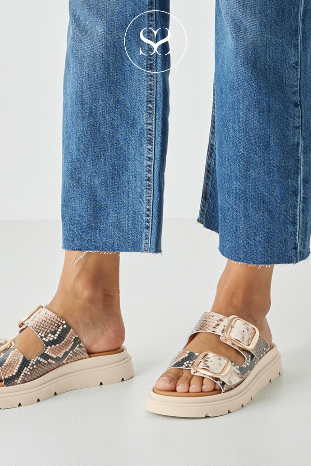 Woman wearing Tamaris Snake Print Chunky Slider Sandals 1-27239-42