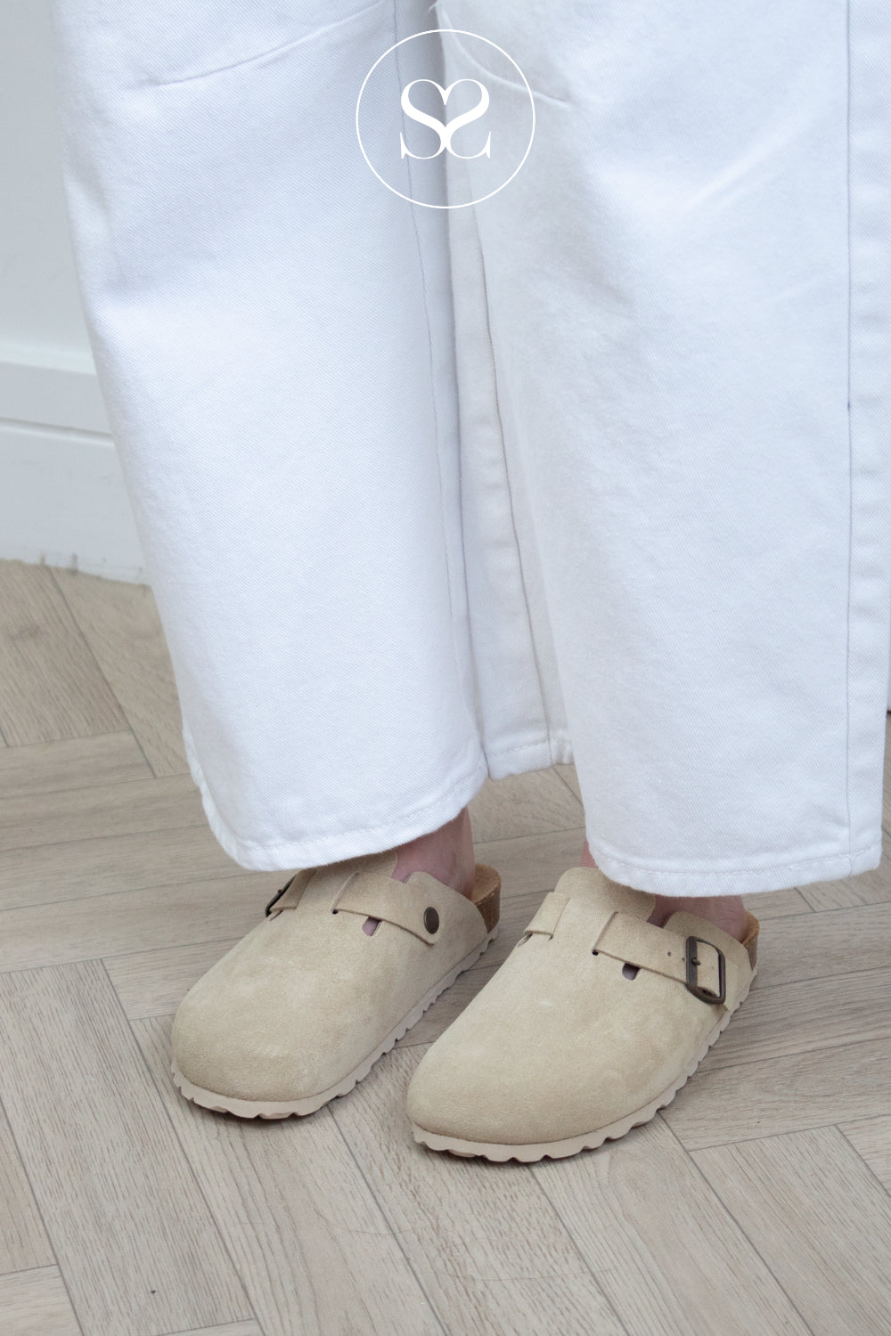 woman wearing comfortable beige slip on clogs from Toni pons available in Ireland