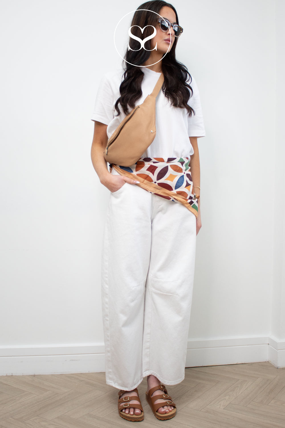 woman wearing toni pons slider sandals in tan leather with adjustable straps