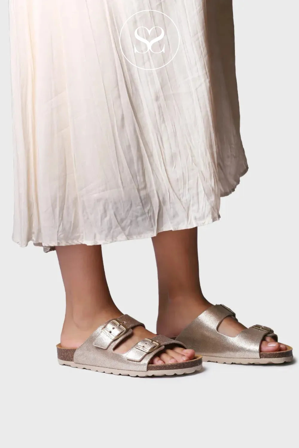 Gold shimmer slip on flat sandals. Slider sandals with double strap and gold adjustable buckles