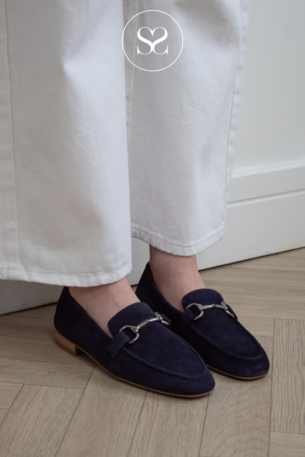Unisa navy suede penny loafers with silver bar from Unisa