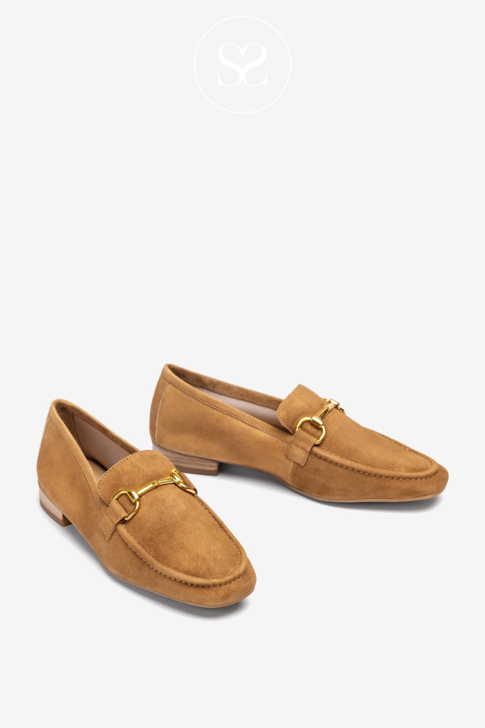 Pair of camel tan suede loafers with slightly squared round toe. Gold chain buckle, low block heel, flat sole and cushioned footbed. Suitable everyday workwear shoe. Office wear.