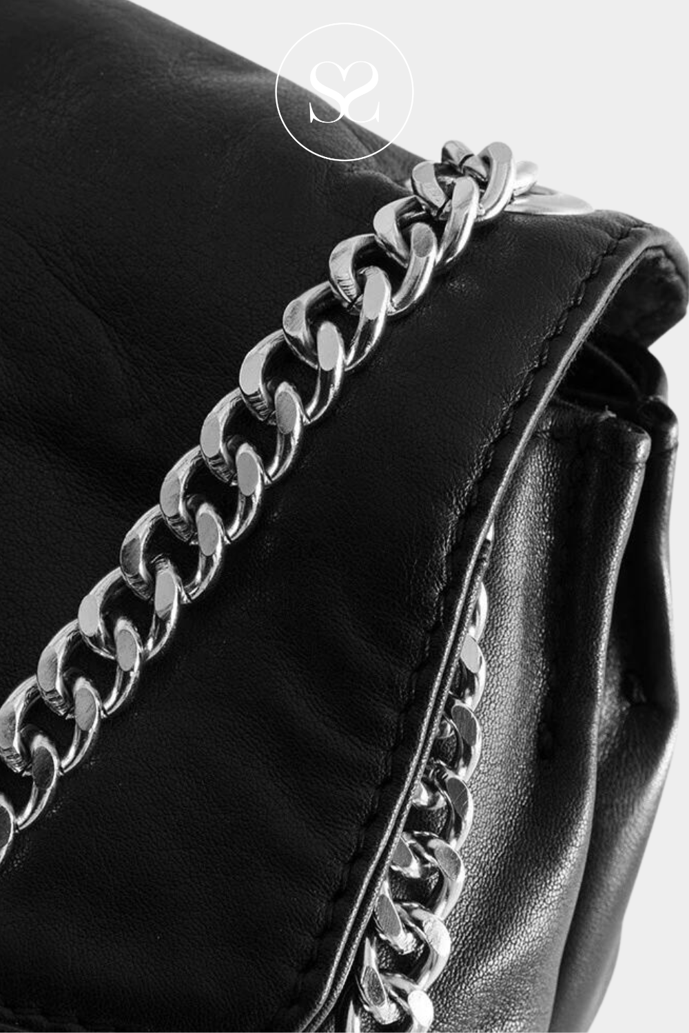 silver chain strap on black depeche bag