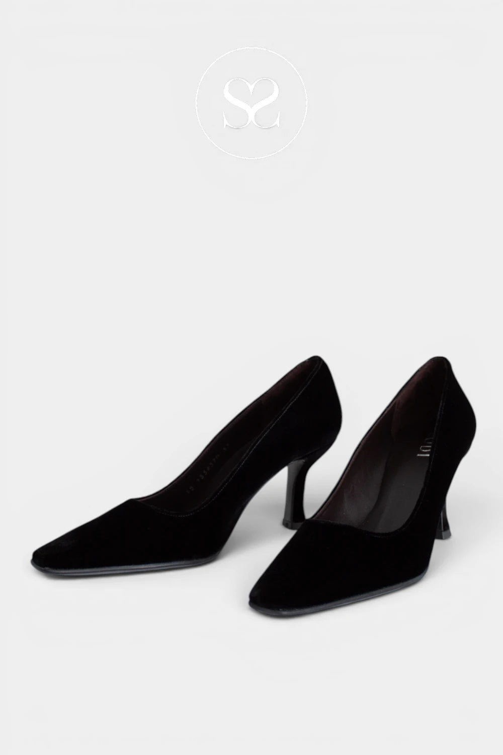 A pair of black pointed-toe kitten heel pumps made of velvet, shown from a side angle on a light gray background.