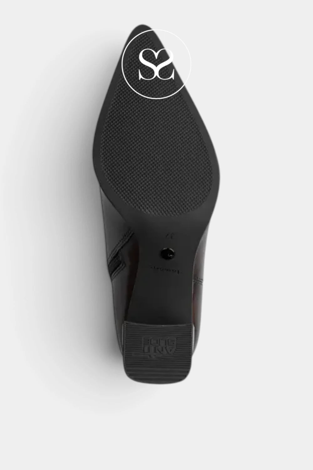 Top-down view of a black pointed-toe shoe sole, showing the textured tread and a debossed logo near the heel, on a light gray background.