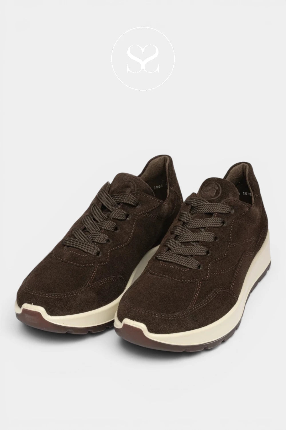 A pair of dark brown suede sneakers with matching laces, featuring a thick cream-colored midsole and a dark brown outsole, shown against a light gray background.