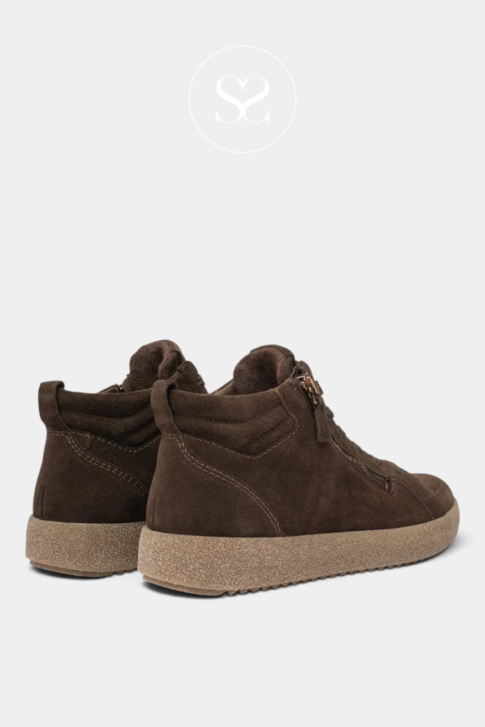 A pair of dark brown suede mid-calf boots with tan textured soles, shown from a three-quarters rear angle on a light gray background.