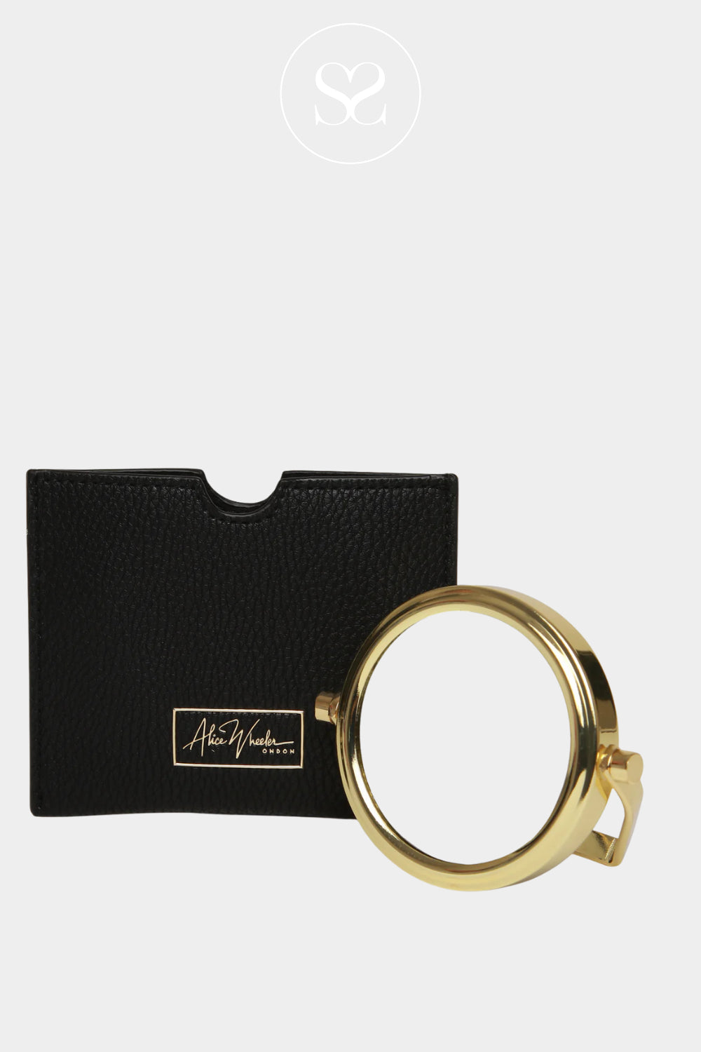 Gold magnifying glass mirror  on a black card with 'Alison Wheeler  branding o
