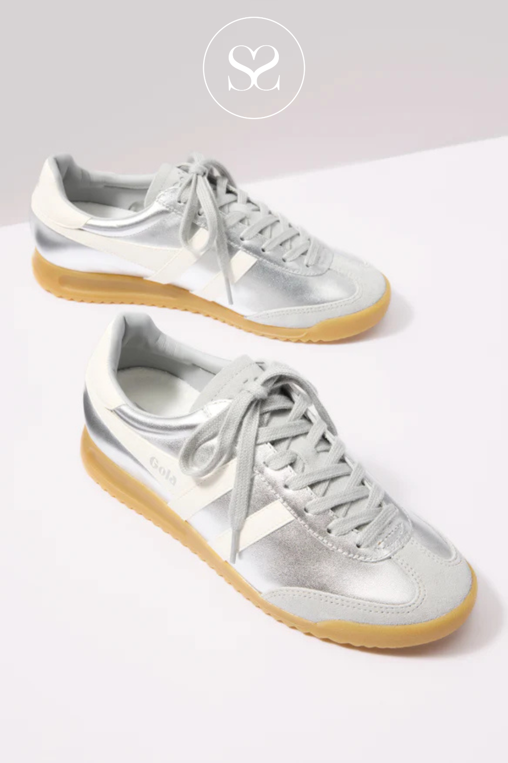 Metallic silver and white low profile women's trainers from Gola