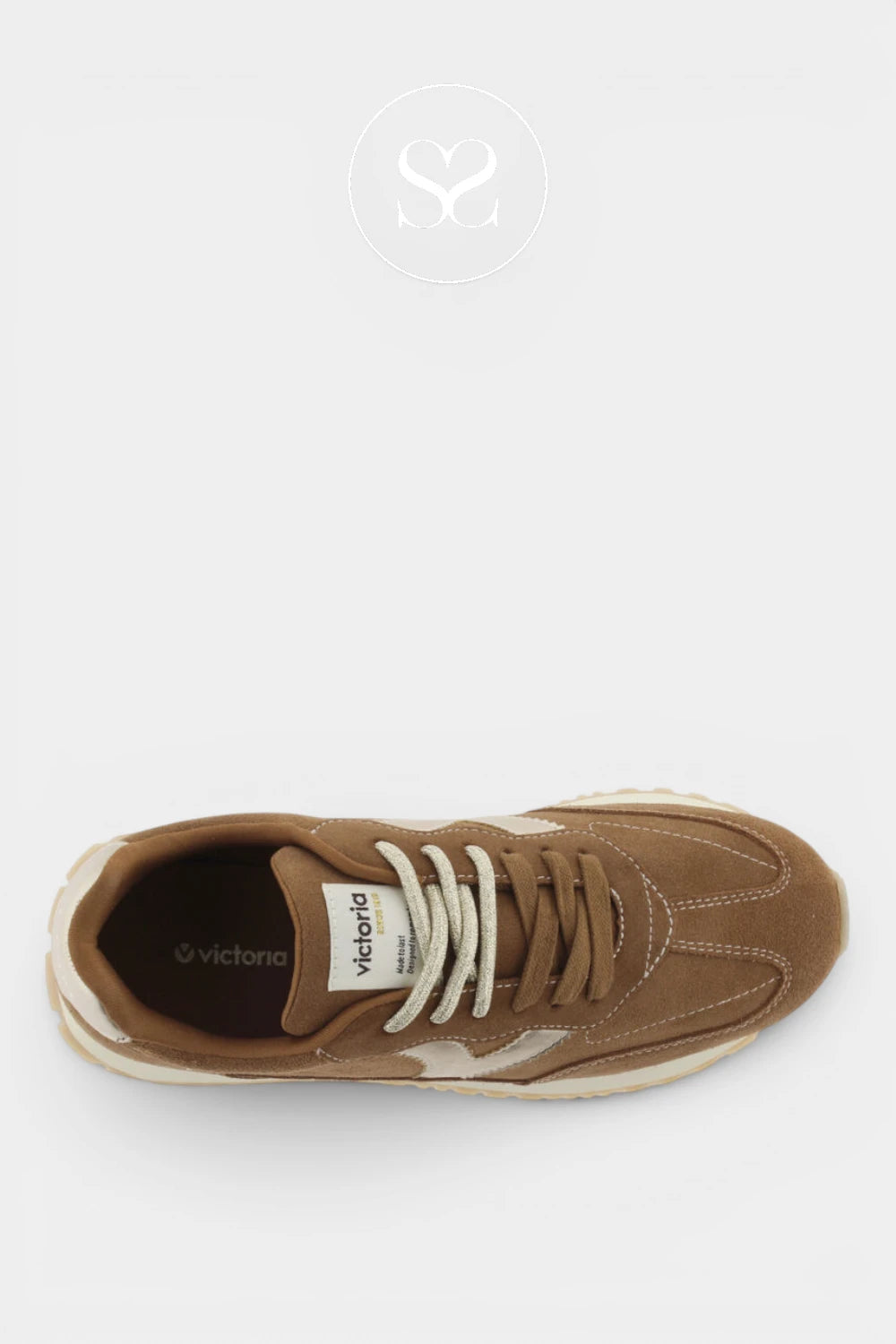 A top-down view of a brown suede and canvas sneaker with white laces and a white midsole, shown on a light gray background with a faint watermark logo above.