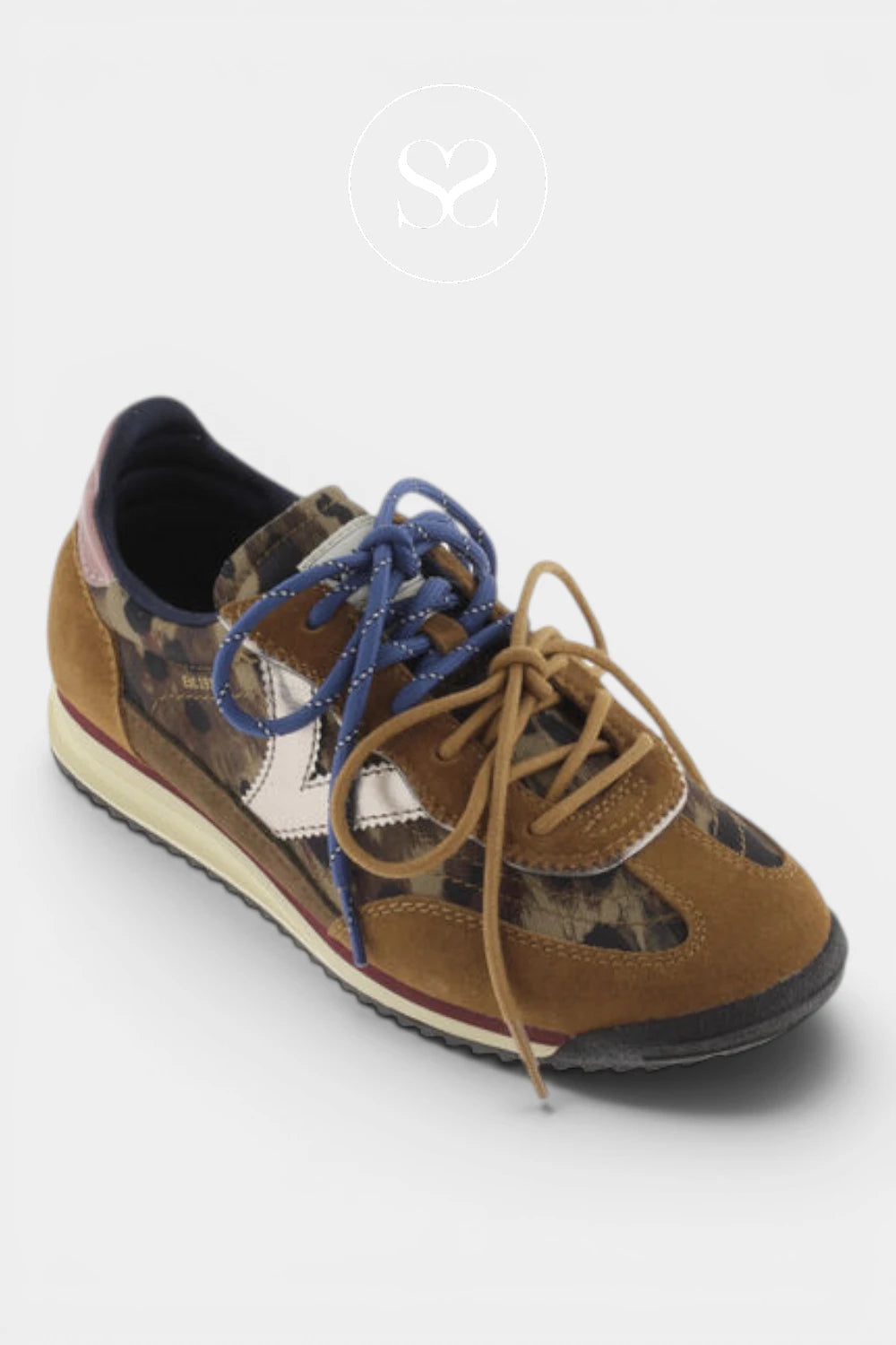 A low-top sneaker featuring a mix of brown suede, camouflage pattern panels, a white star logo, and blue laces, shown on a light gray background.