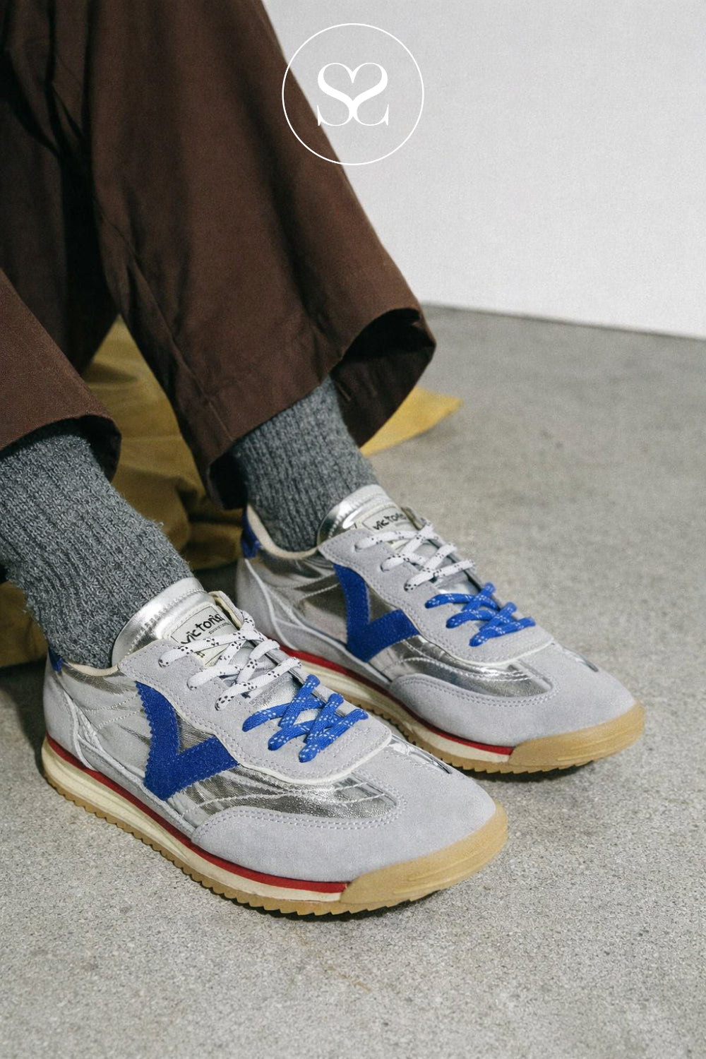 Woman wearing silver metallic trainers from Victoria in Ireland