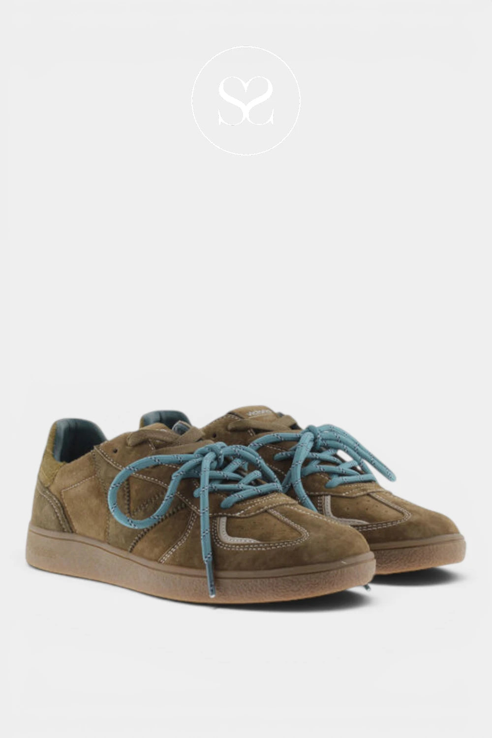 A pair of low-top suede sneakers in brown with contrasting blue laces, shown against a light gray background with a faint logo watermark at the top.