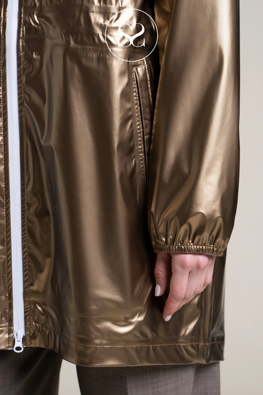 Zip closure and Compact Jacket that Folds into a Bag When Needed