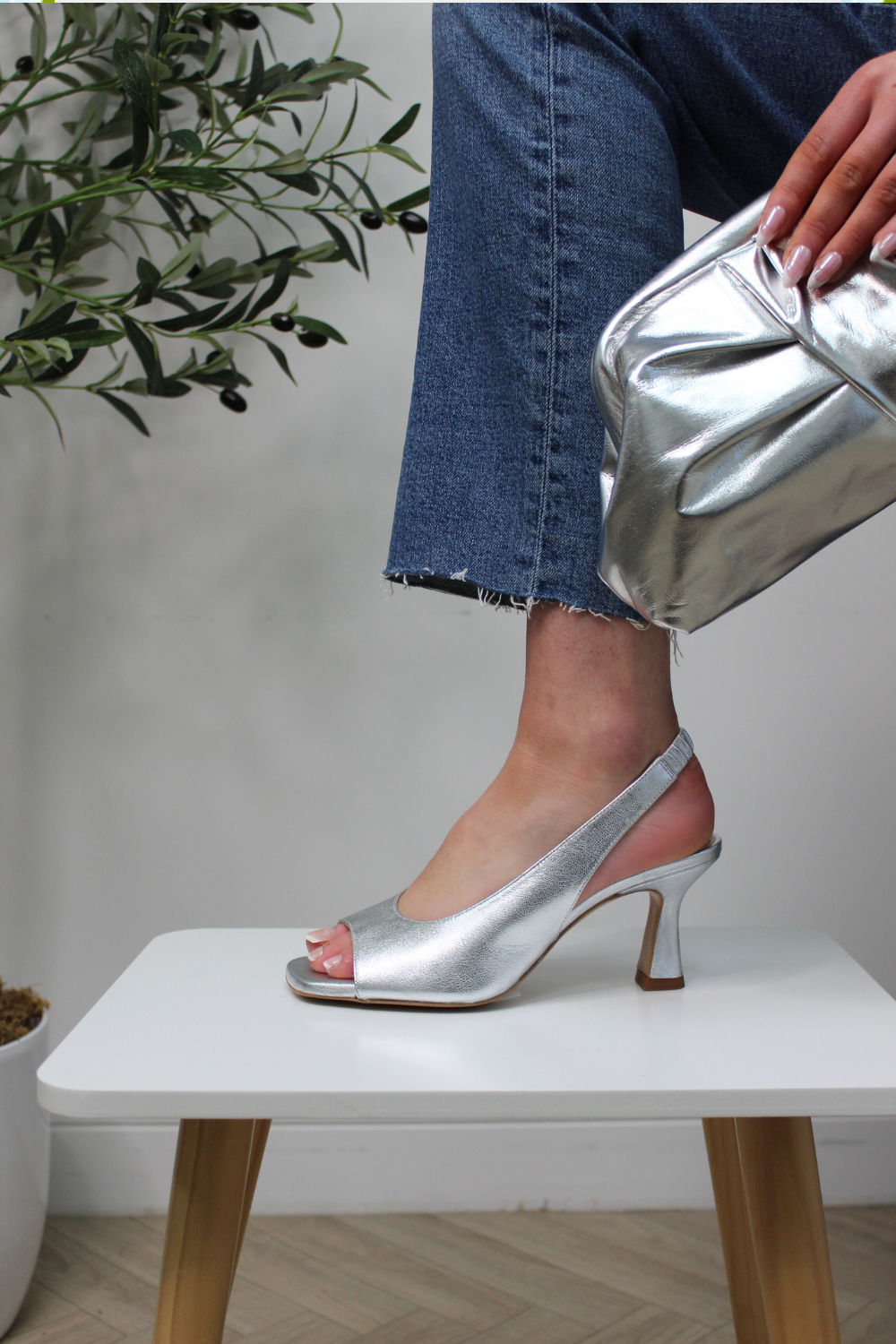 Lodi ludvig silver high heeled slingback sandals. Flared heel, elasticted slingback, metallic and gel cushioning