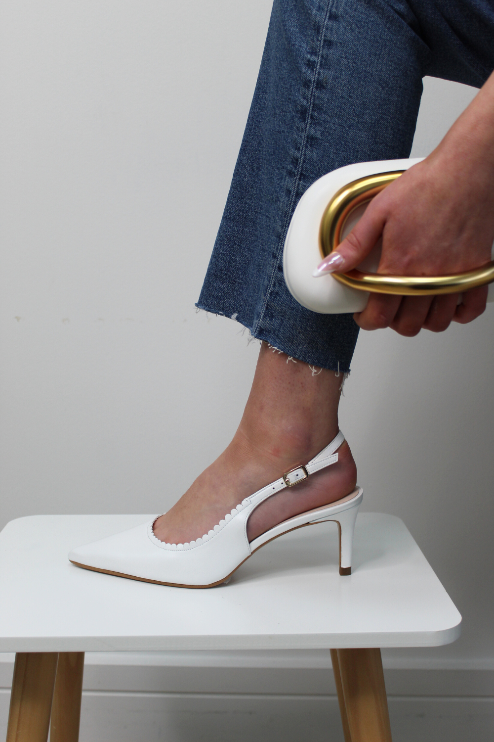 Lodi white pointed toe slingback mid heel with scalloped edging