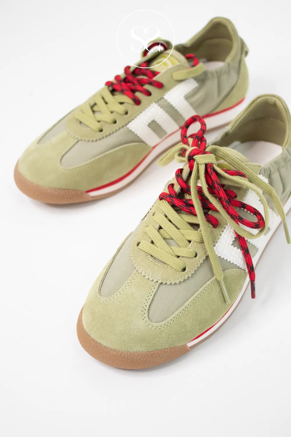Green and red trainers. Neat around the ankle with elasticated material for snug fit. Double lace with the option of wearing separately as plain green lace or red.
