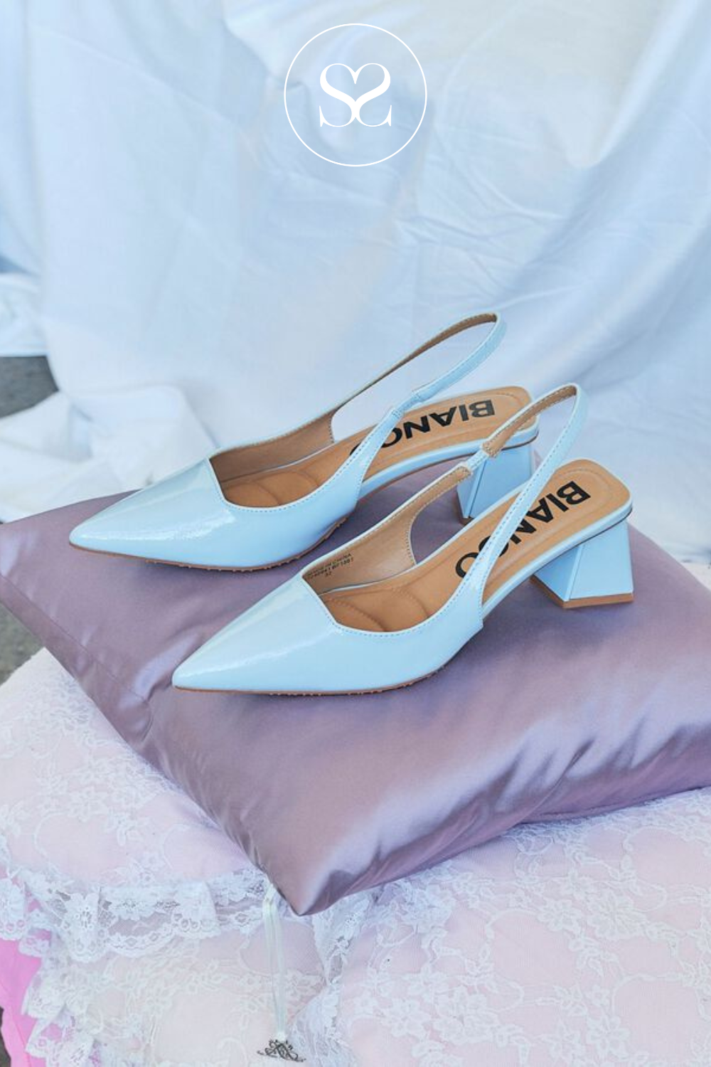 Pale blue patent occassion shoes. Dressy pointed toe heels. Triangular block heel with elasticated slingback and cushioned insole