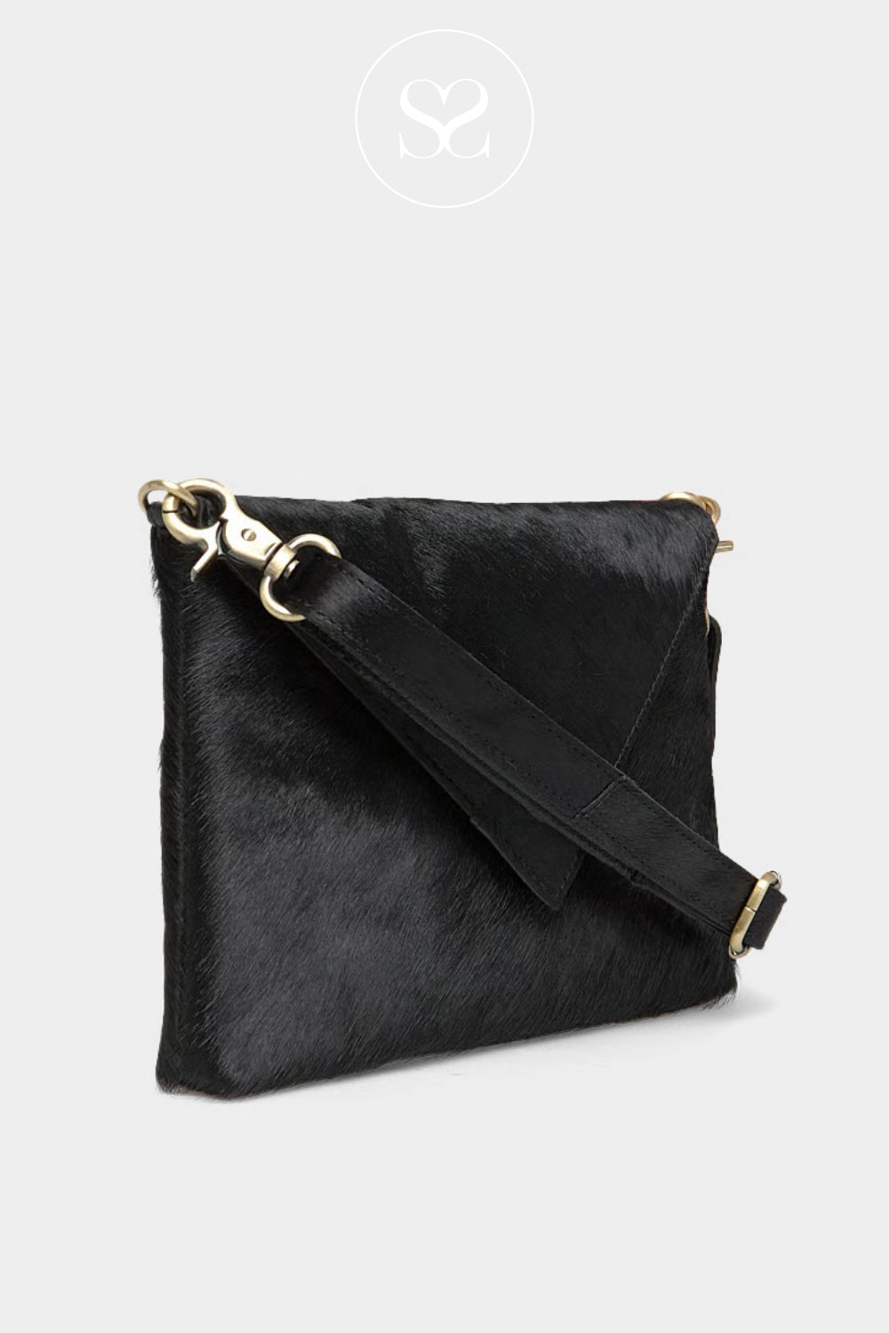 Hair-on leather exudes luxury
Edgy, graphic flap design
Versatile; can be carried in hand, on the shoulder, or crossbody