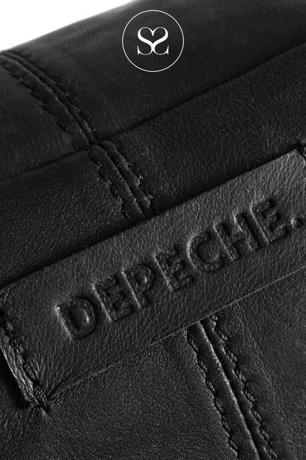Close-up of black leather with 'Depeche' branding and logo.