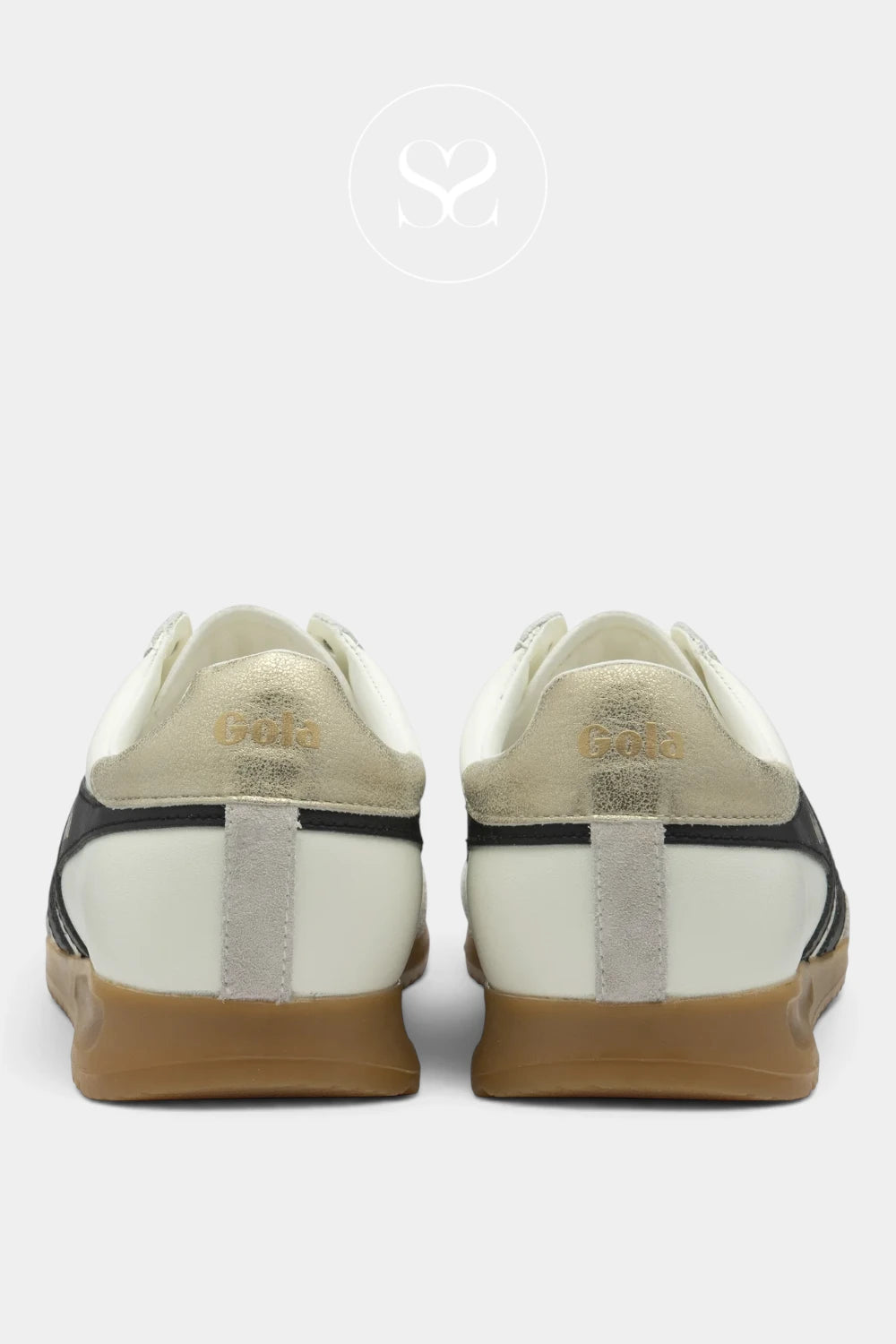 A pair of low-top sneakers shown from the back, featuring a cream and white leather upper with black side stripes, a gold 'Gold' logo on the heel, and a brown gum sole, set against a light gray background.