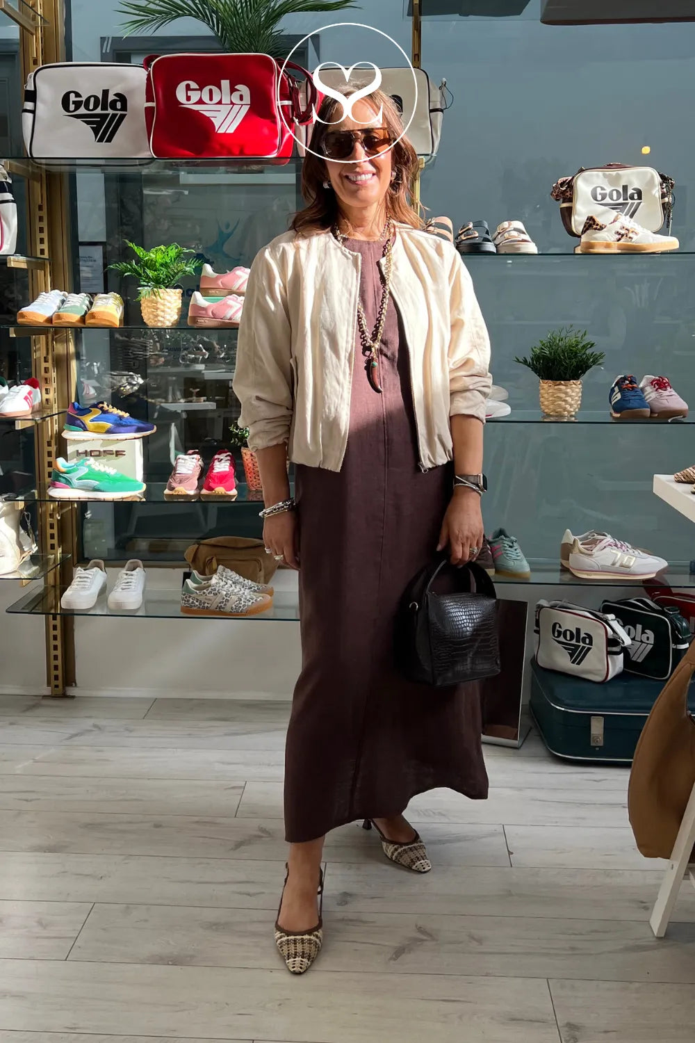 Women wearing lodi woven slingbacks with brown linen dress