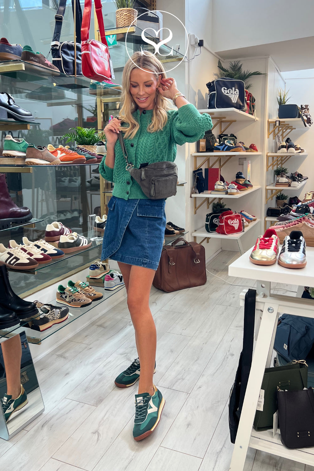 Woman wearing green trainers from Victoria brand