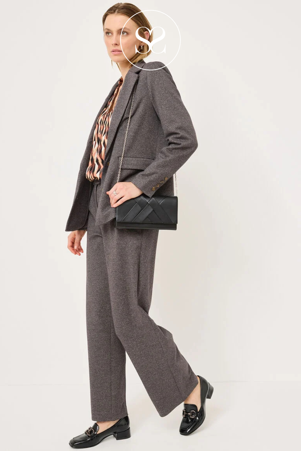 Black patent loafer with low block heel. Comfortable leather footbed. Square toe, low heel. Office shoe
