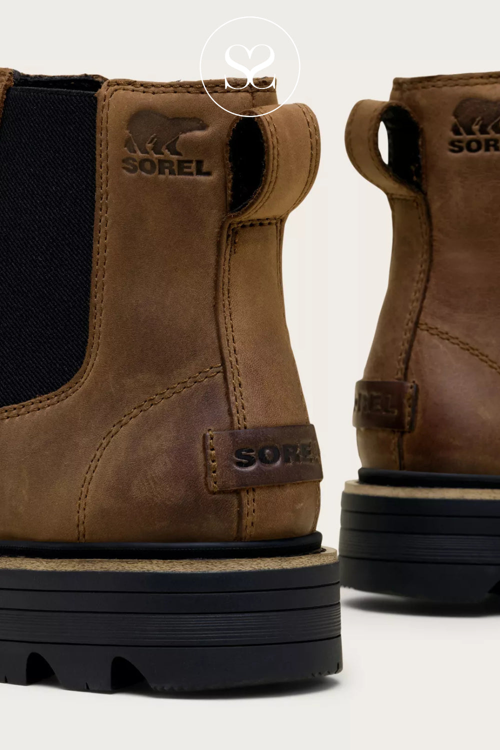 Brown Sorel waterproof boots with black soles on a white background