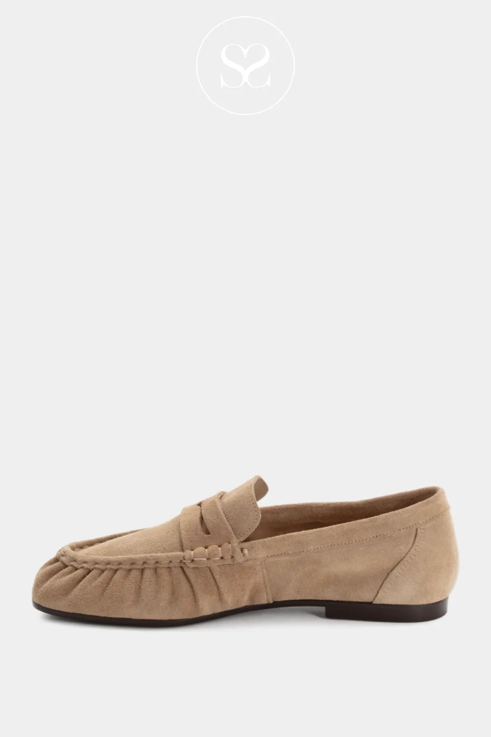 Tamaris beige suede slip on loafers with round toe.