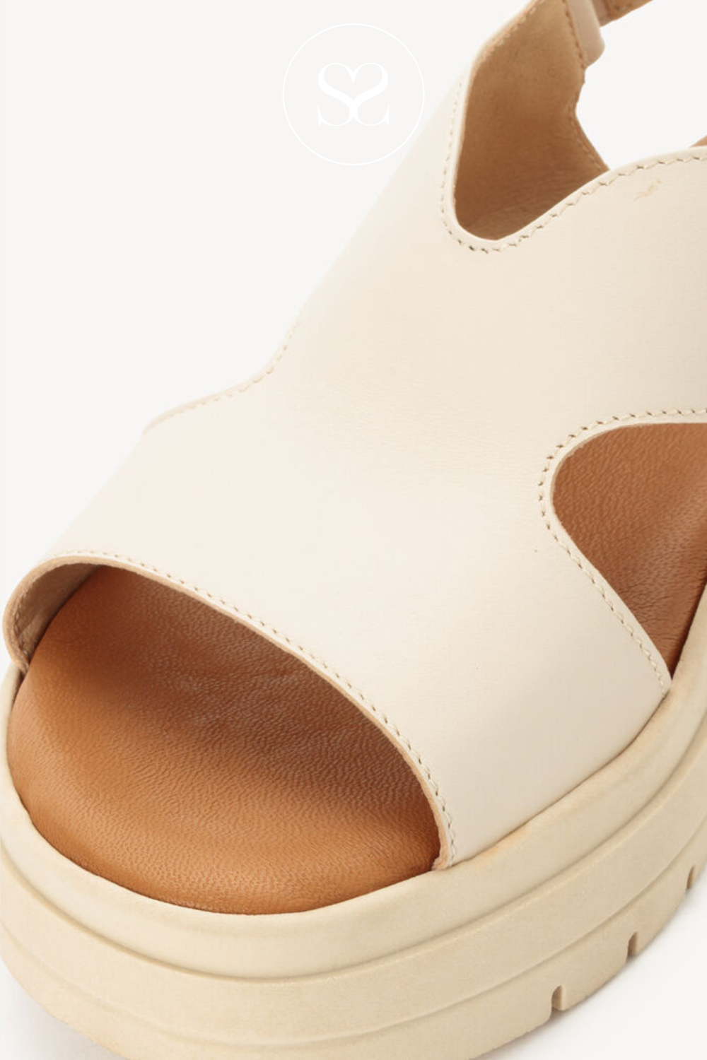 Cream comfortable sandals with cushioned insole and coverage across the foot