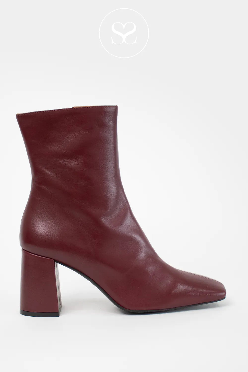 Maroon ankle boot with a block heel on a white background from Angel Alarcon - In Ireland