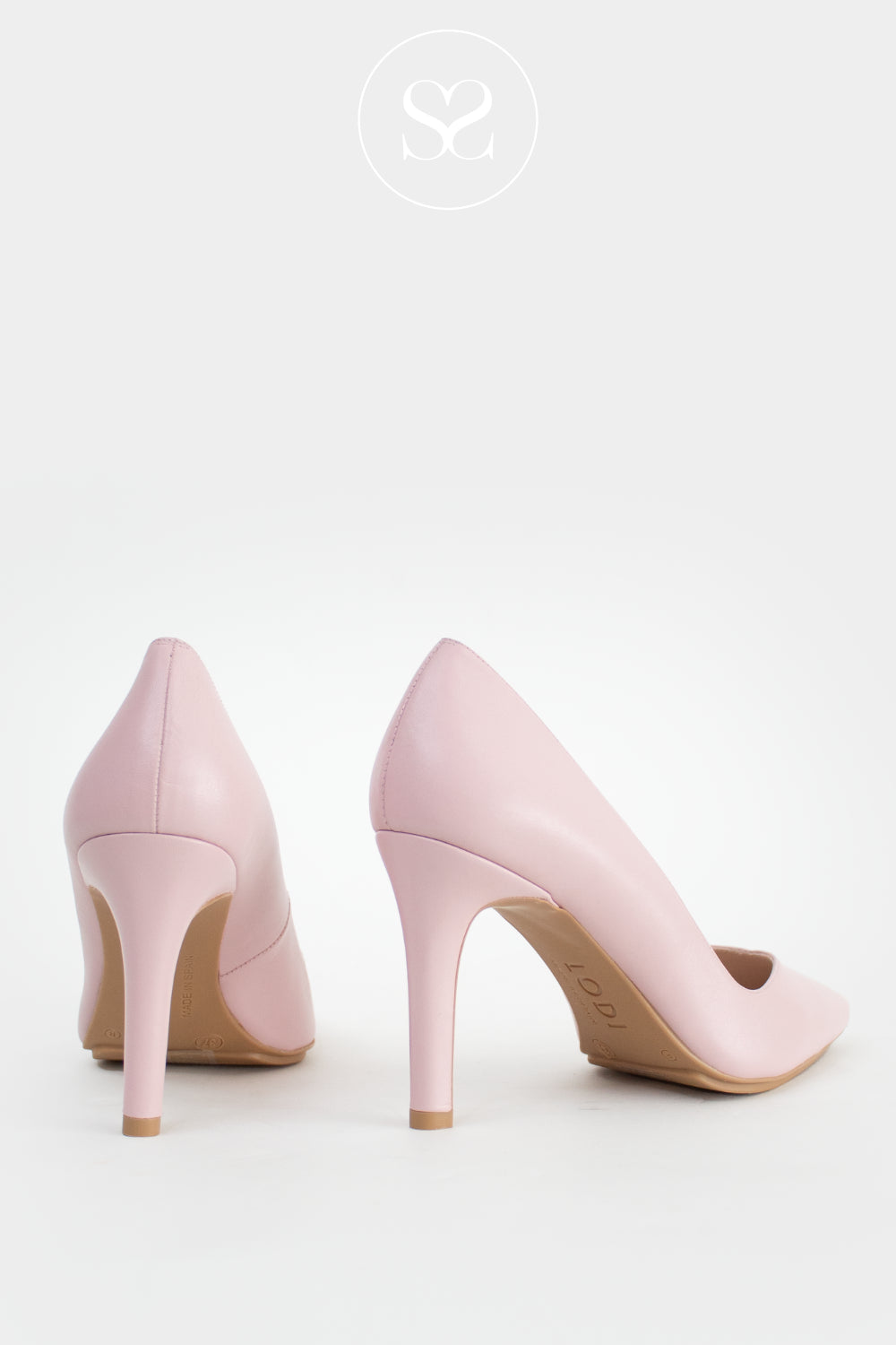 Pair of pink high-heeled shoes on a white background