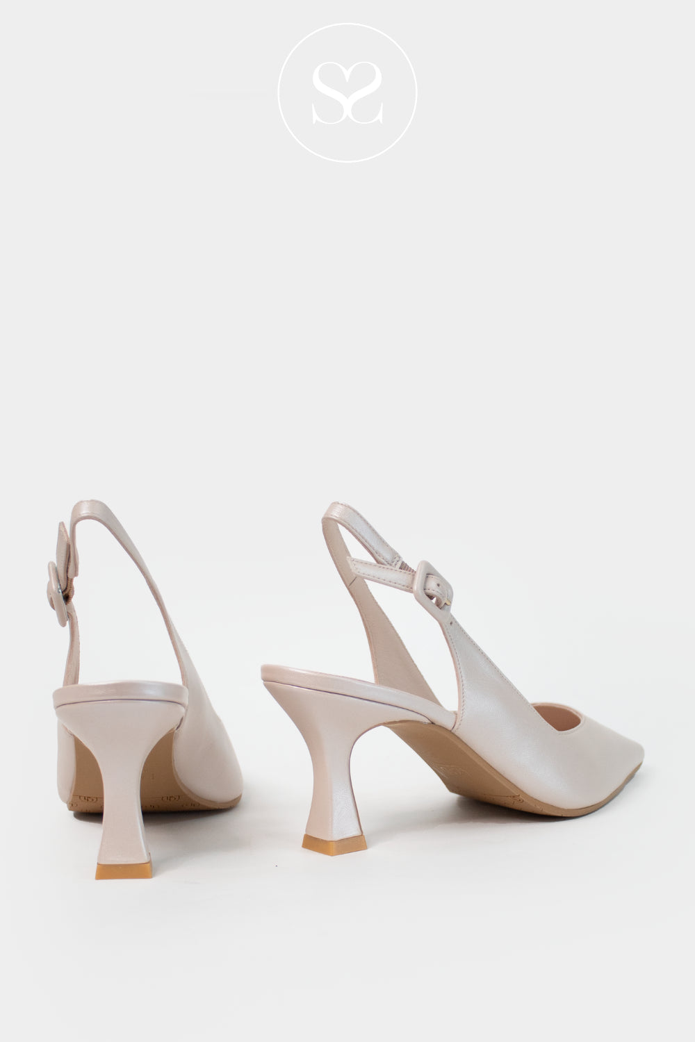 Pair of beige high-heeled shoes on a white background