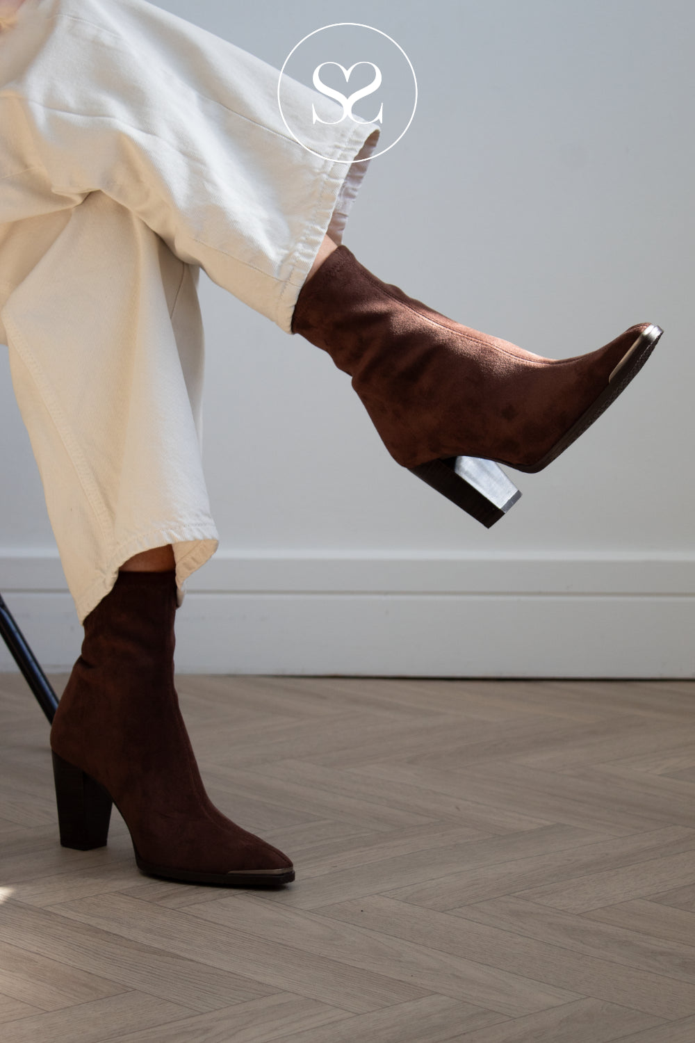 woman wearing pointed toe western style boots in brown suede from Miss Elastic