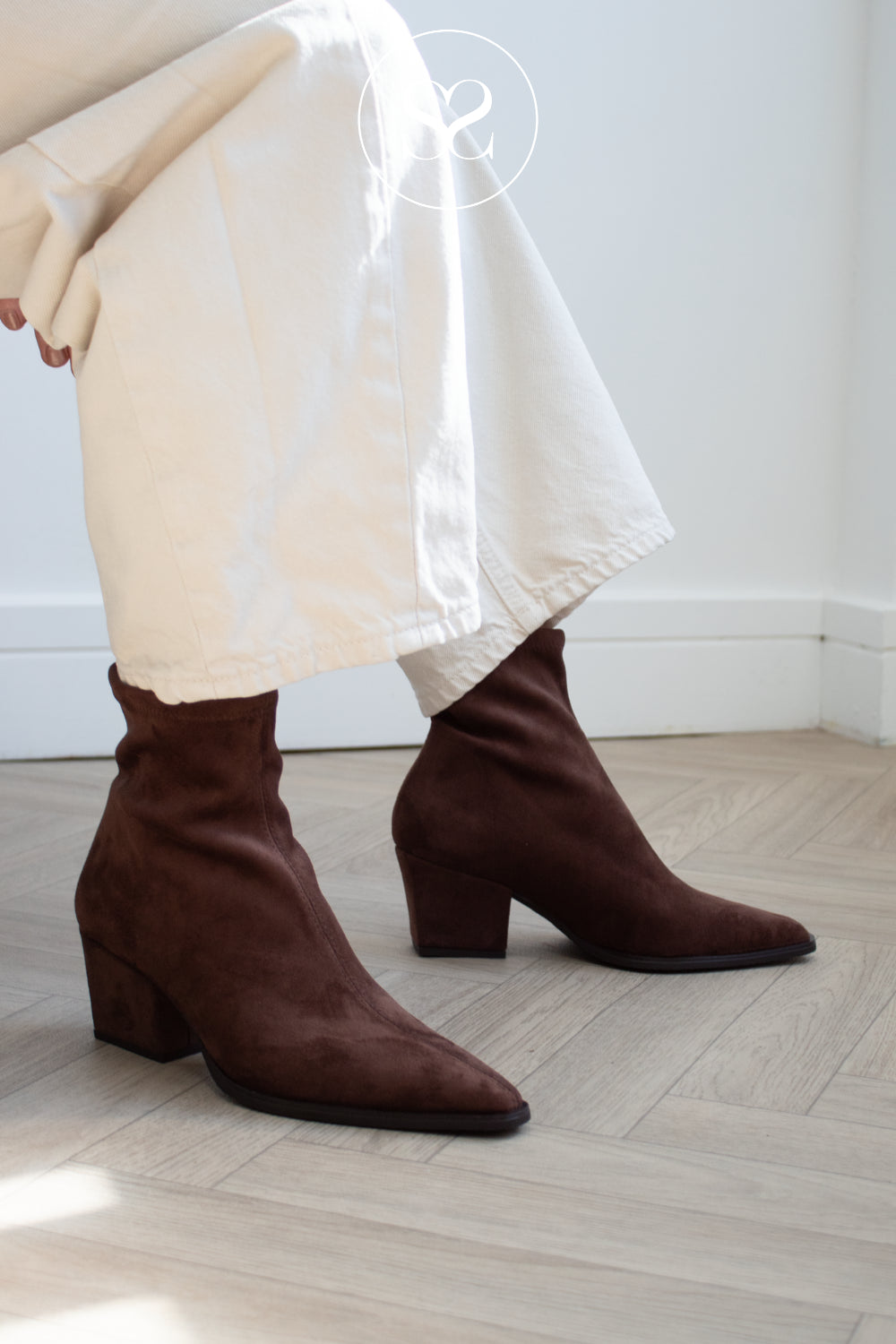 woman wearing dark brown suede western style ankle boots from Miss Elastic