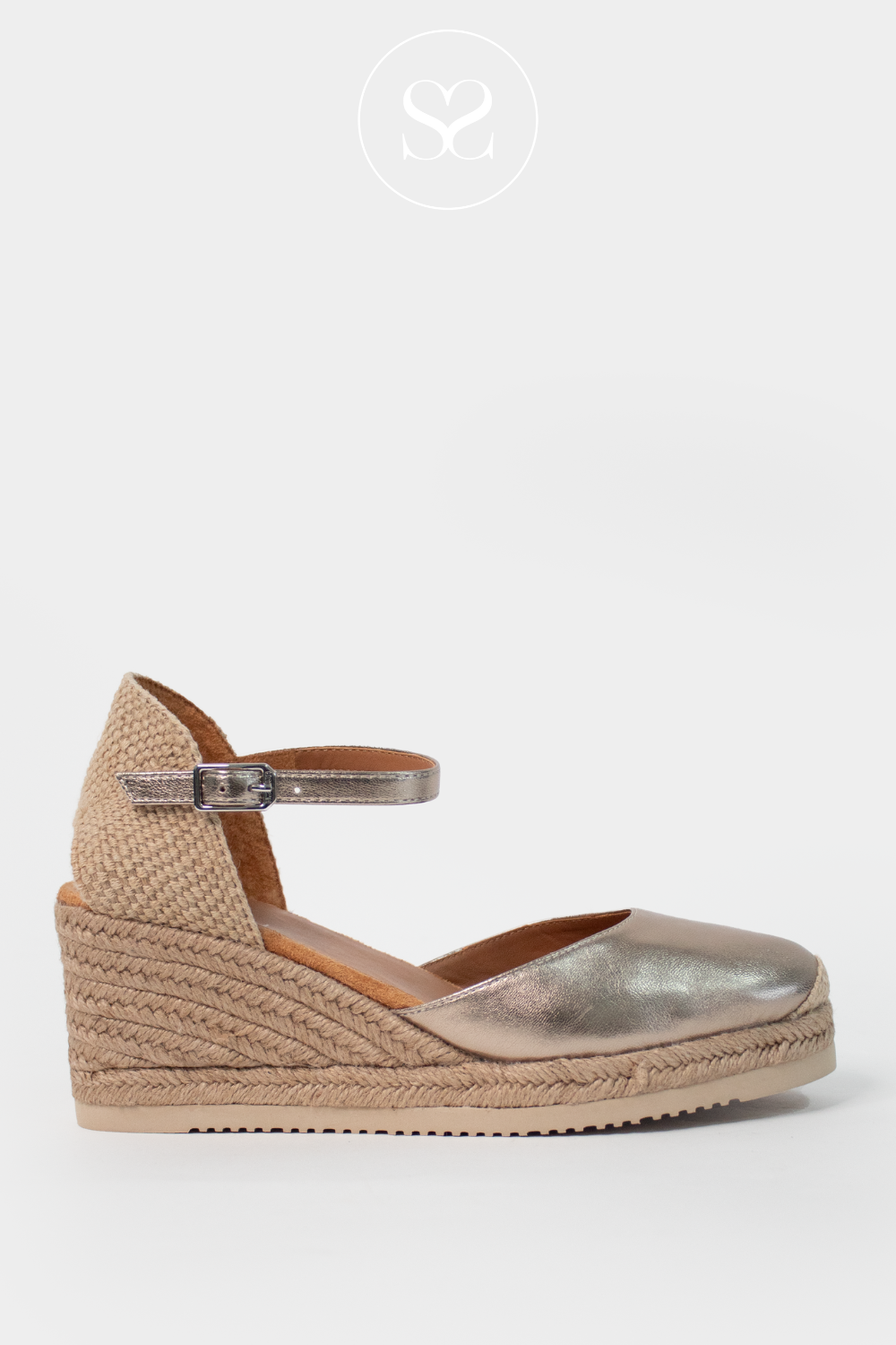 Unisa caceres bronze metallic espadrille wedge sandal. Round toe, elevated sole and adjustable ankle strap.
