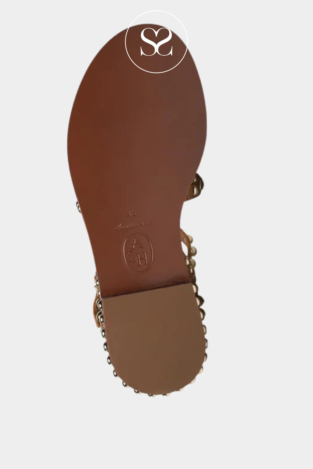 Brown sandal sole with gold chain detail on a light gray background
