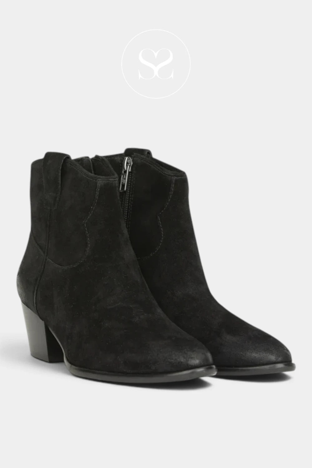 A pair of black suede ankle boots with a low block heel and side zipper, shown against a light gray background.