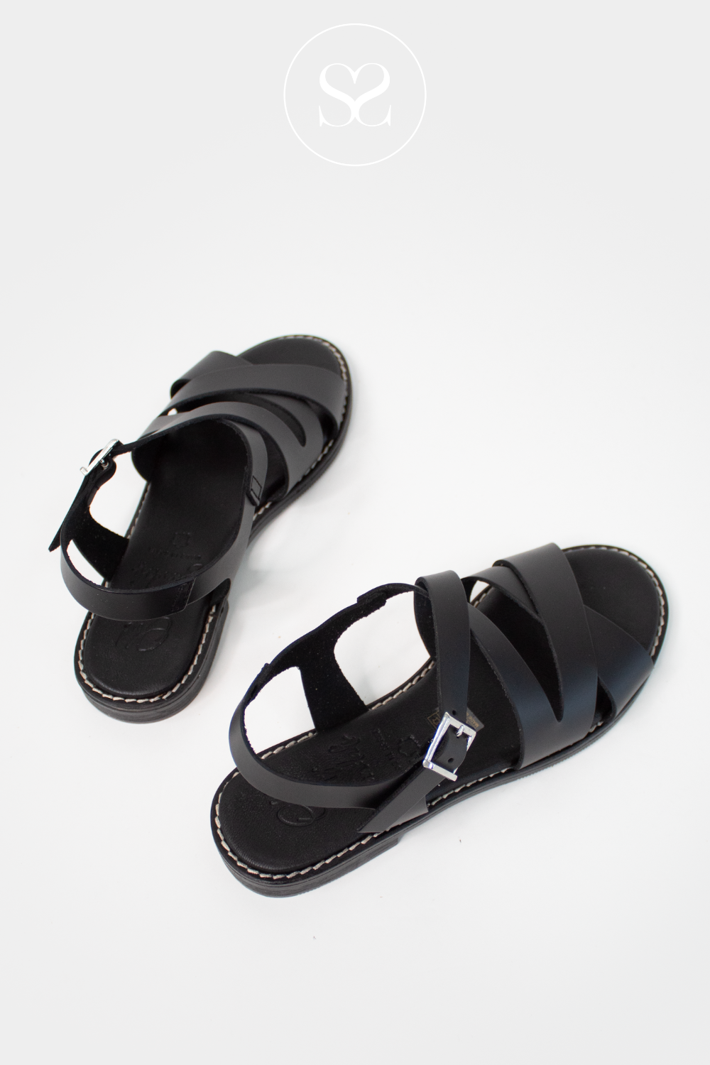 Black leather flat sandals wit cross straps from oh my sandals