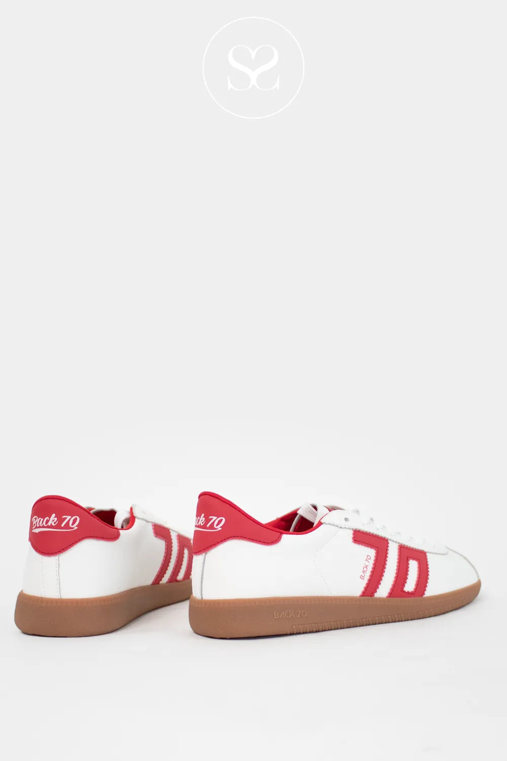 White leather trainers with red heel cap and Back 70 logo. Retro style sneakers with laces and gum sole.